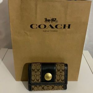Coach brown signature wristlet